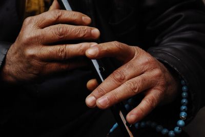 Close-up of man holding hands