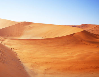 Scenic view of desert against clear sky