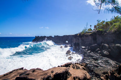 Scenic view of sea against blue sky