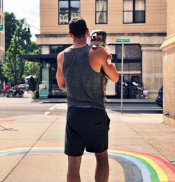 Rear view of man standing in a city