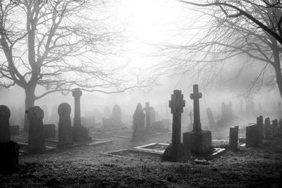 Panoramic view of cemetery against foggy weather