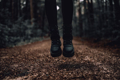 Low section of person standing on ground