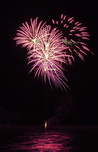 Firework display at night