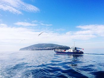 Scenic view of sea against blue sky