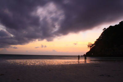 Scenic view of beach against sky during sunset