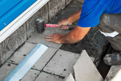 Low section of man working in workshop