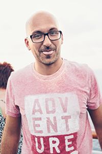 Portrait of smiling young man wearing eyeglasses