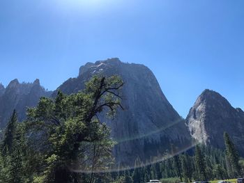 Scenic view of mountains against clear blue sky