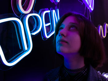 Portrait of a young woman looking away