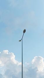 Low angle view of street light against sky