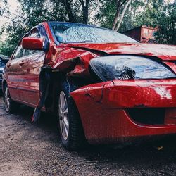 Old abandoned car on land