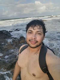 Portrait of young man on beach