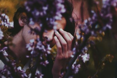Close-up of person by plants
