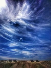 Scenic view of landscape against cloudy sky