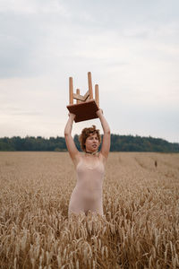 Full length of man standing in field