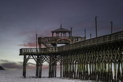 Pier over sea against clear sky