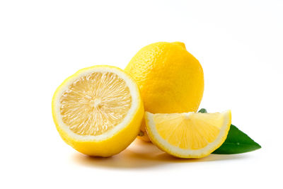 Close-up of orange fruit against white background