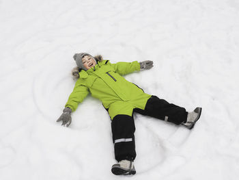 Low section of woman skiing on snow
