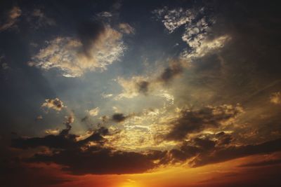 Low angle view of dramatic sky during sunset