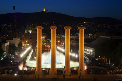 Illuminated buildings in city at night