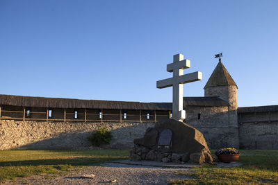 Cross against clear blue sky