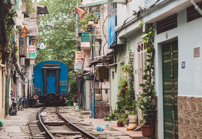 Train amidst buildings in city