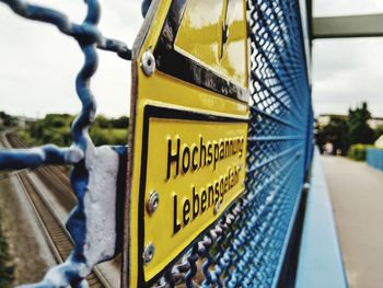 Close-up of information sign on road