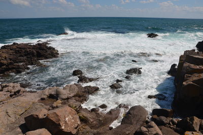 Scenic view of sea shore against sky