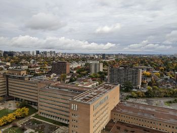 High angle view of buildings in city against sky