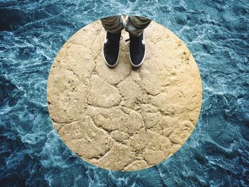 High angle view of person standing in water