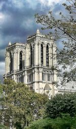 Low angle view of cathedral against cloudy sky