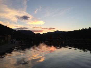 Scenic view of lake at sunset