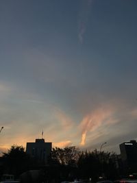 Low angle view of silhouette city against sky during sunset