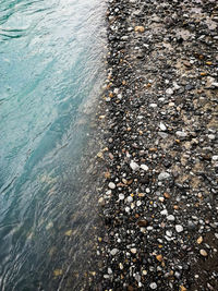 High angle view of stones in sea