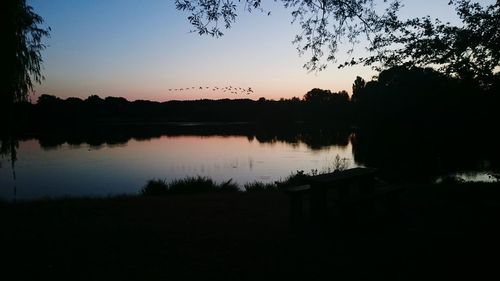 Scenic view of lake at sunset