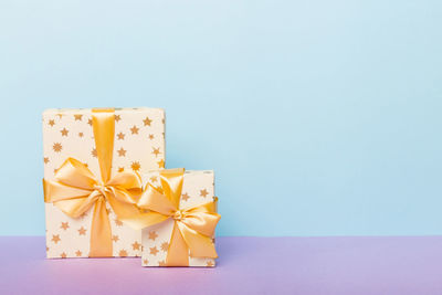 Close-up of christmas presents against white background