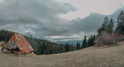 Panoramic view of trees and buildings against sky