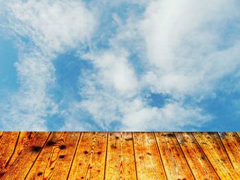 Close-up of wood against sky