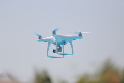 Low angle view of drone against sky