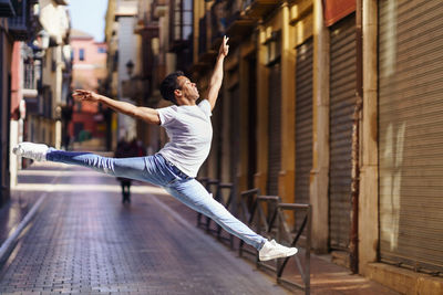 Full length of young man jumping