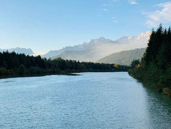 Scenic view of lake and mountains against sky