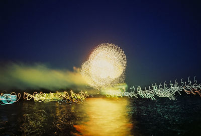 Illuminated fountain at night