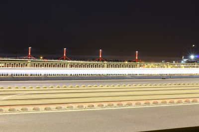 Illuminated building against sky at night