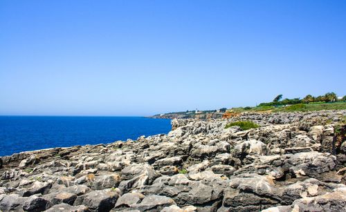 Scenic view of sea against clear blue sky