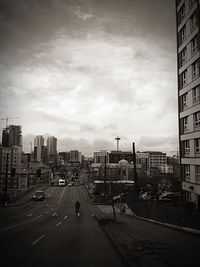 City street against cloudy sky