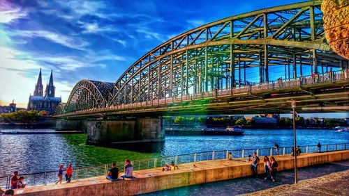 Bridge over river with city in background