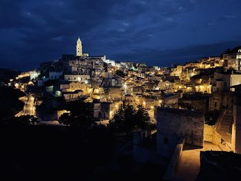 High angle view of illuminated buildings in city at night