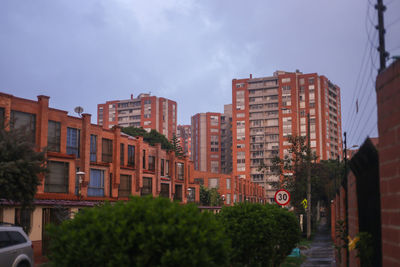 Buildings in city against sky