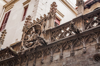 Low angle view of statues on building wall