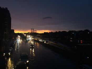 Illuminated city at sunset